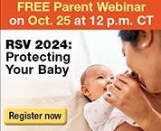 A woman is holding a baby in her arms.