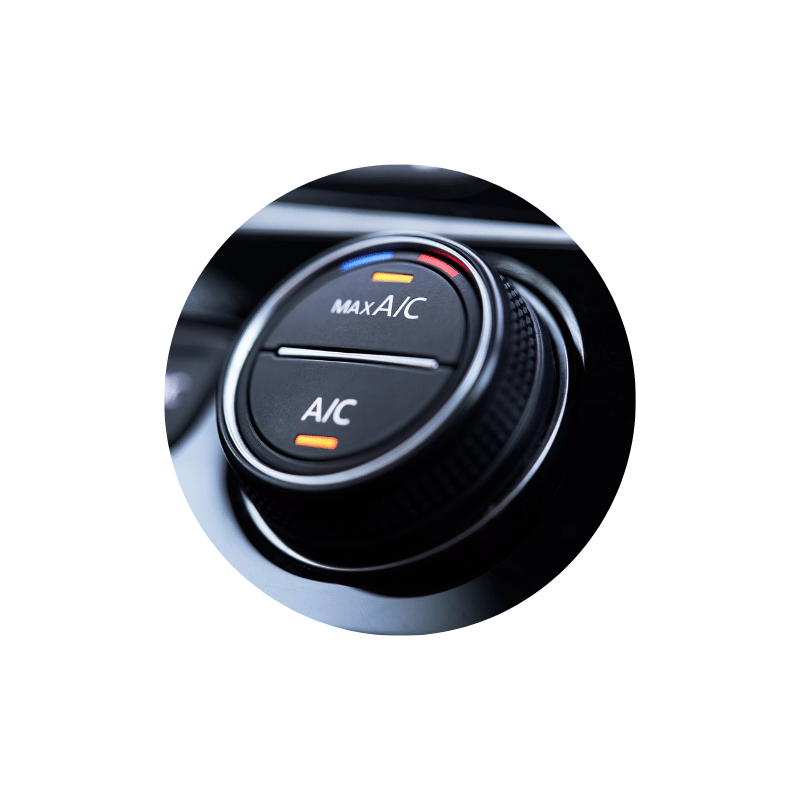 Close-up of a vehicle climate control knob showing A/C and MAX A/C settings used for cabin cooling and comfort.
