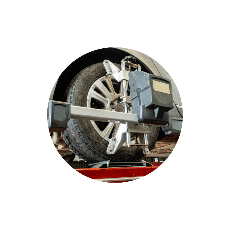 Wheel alignment equipment attached to a vehicle tire during a precision alignment service to improve handling and tire life.