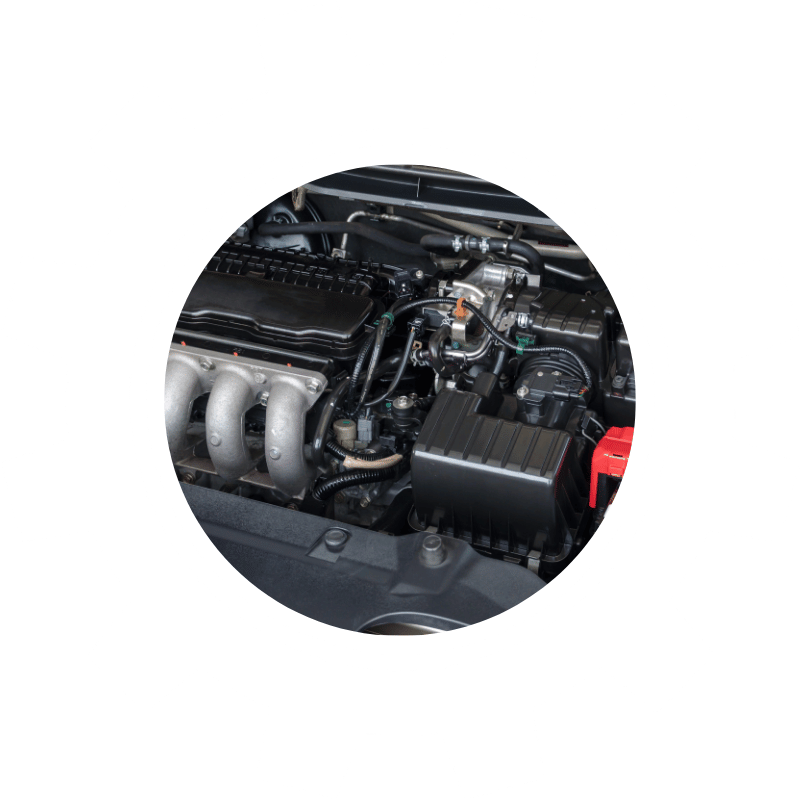 Vehicle engine bay showing electrical components, wiring, and battery connections serviced during electrical diagnostics and repairs.