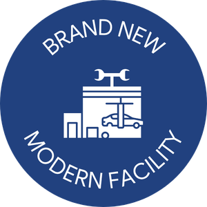 Blue circle with a white icon of an auto shop labeled, 