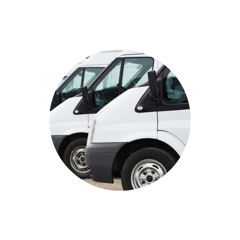 Multiple commercial service vans parked in a row, representing maintenance and repair solutions for fleet vehicles.