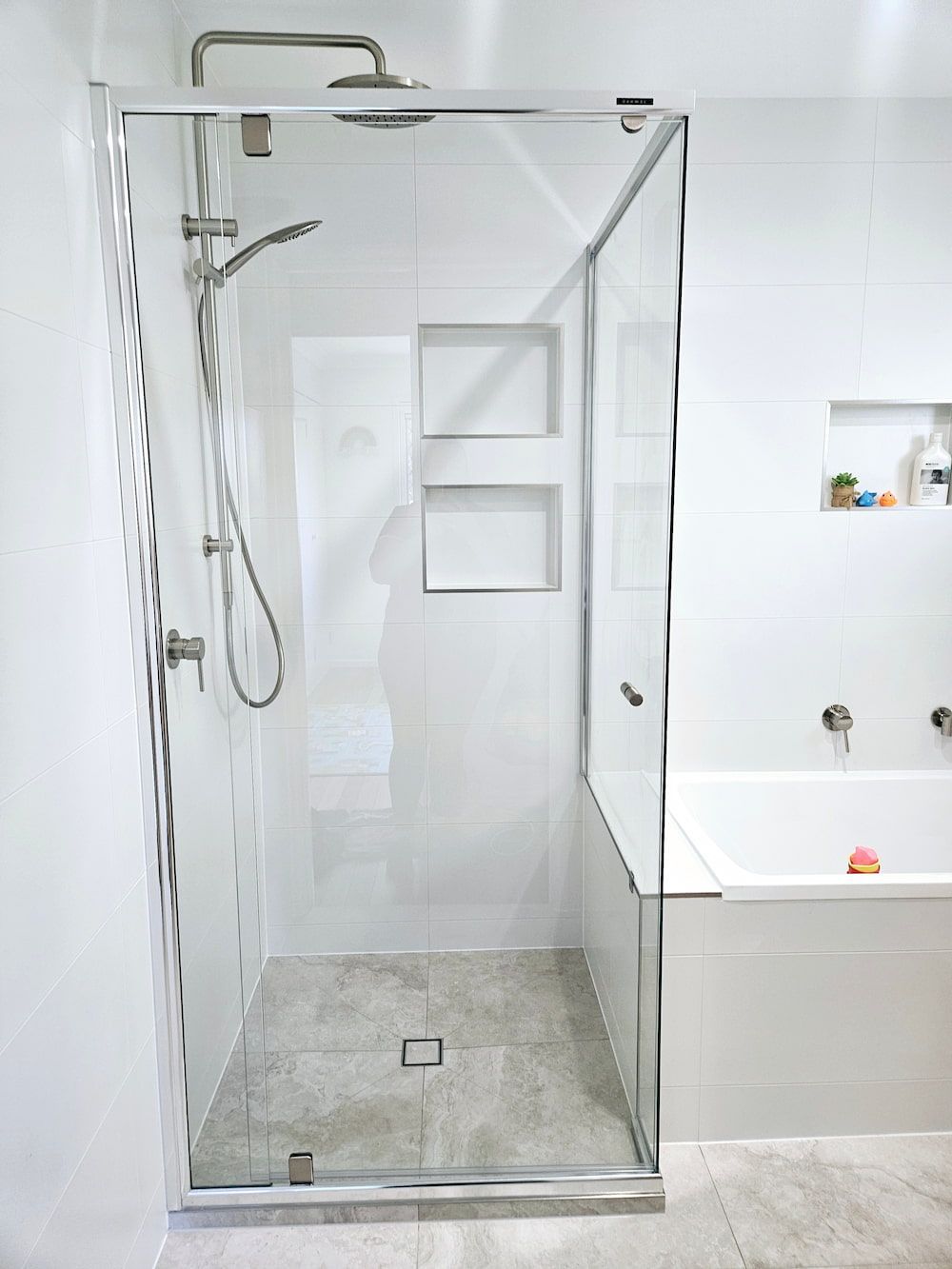 A Bathroom With A Walk In Shower And A Bathtub — Mobile Shower Door Doctor In Mountain Creek, QLD