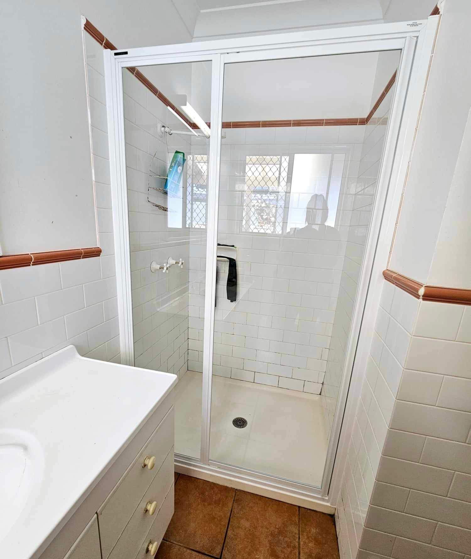 A Bathroom With A Walk In Shower And A Sink — Mobile Shower Door Doctor In Mountain Creek, QLD