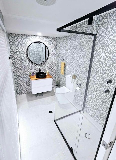 A Bathroom With A Walk In Shower, Sink, Toilet And Mirror — Mobile Shower Door Doctor In Mountain Creek, QLD