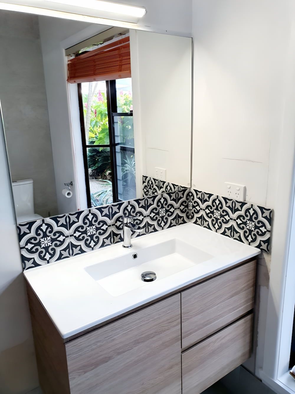 A Bathroom With A Sink And A Mirror — Mobile Shower Door Doctor In Mountain Creek, QLD