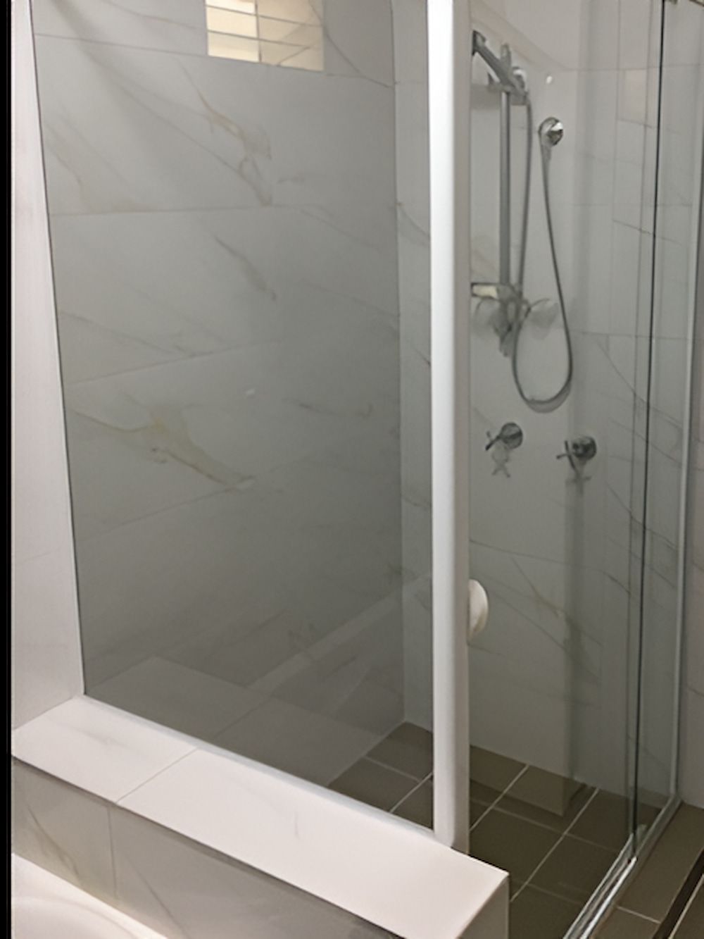 A Bathroom With A Shower , Sink And Mirror — Mobile Shower Door Doctor In Maroochydore, QLD