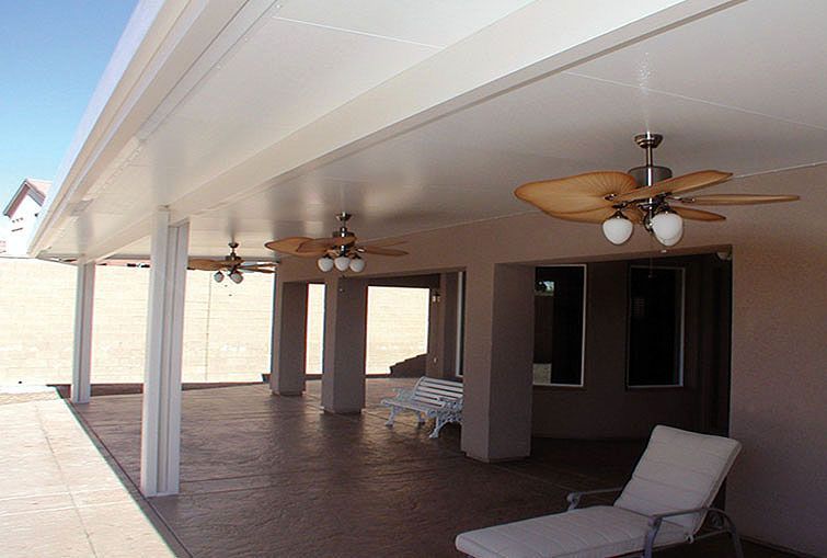 Patio with a white ceiling, columns, ceiling fans, and a lounge chair.