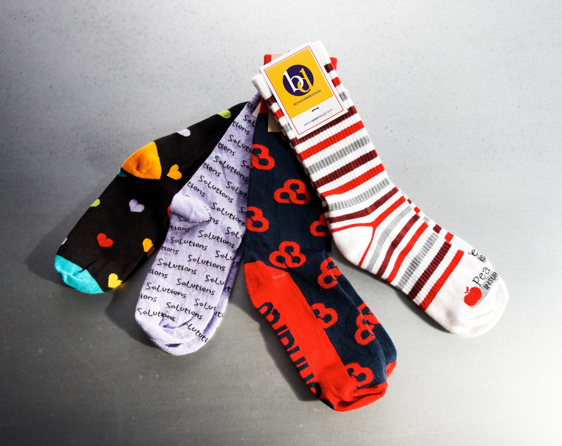Three pairs of socks are stacked on top of each other