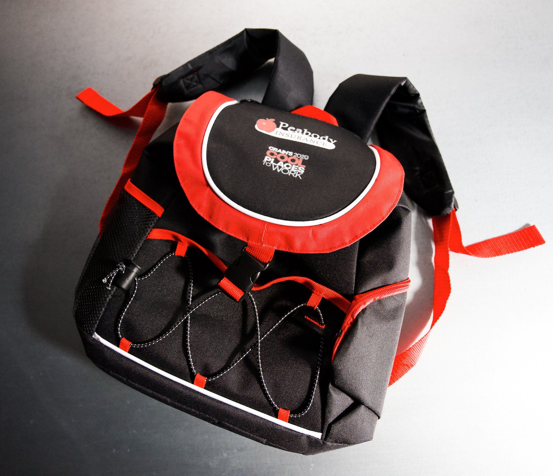 A black and red backpack with the word reebok on it