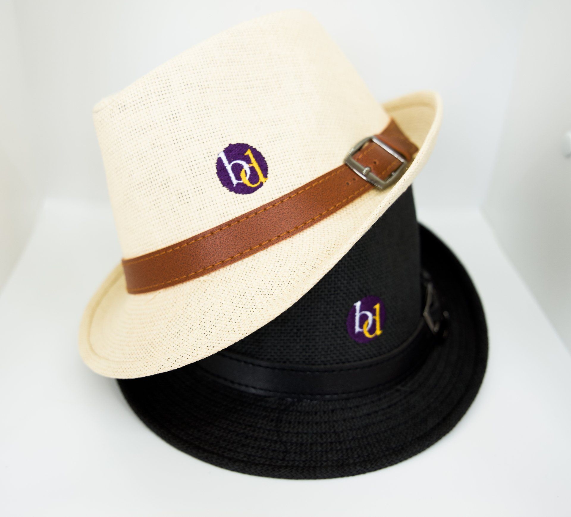 Two hats with the letter b on them