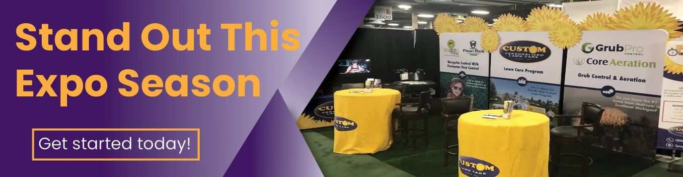 Purple expo banner with yellow text and call-to-action beside a yellow booth display and product setup.