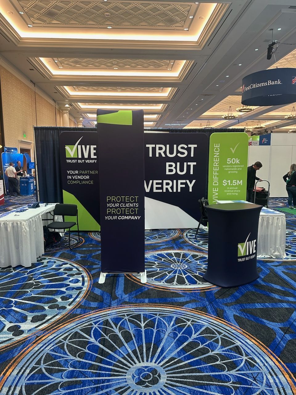 A large room with a sign that says `` trust but verify ''