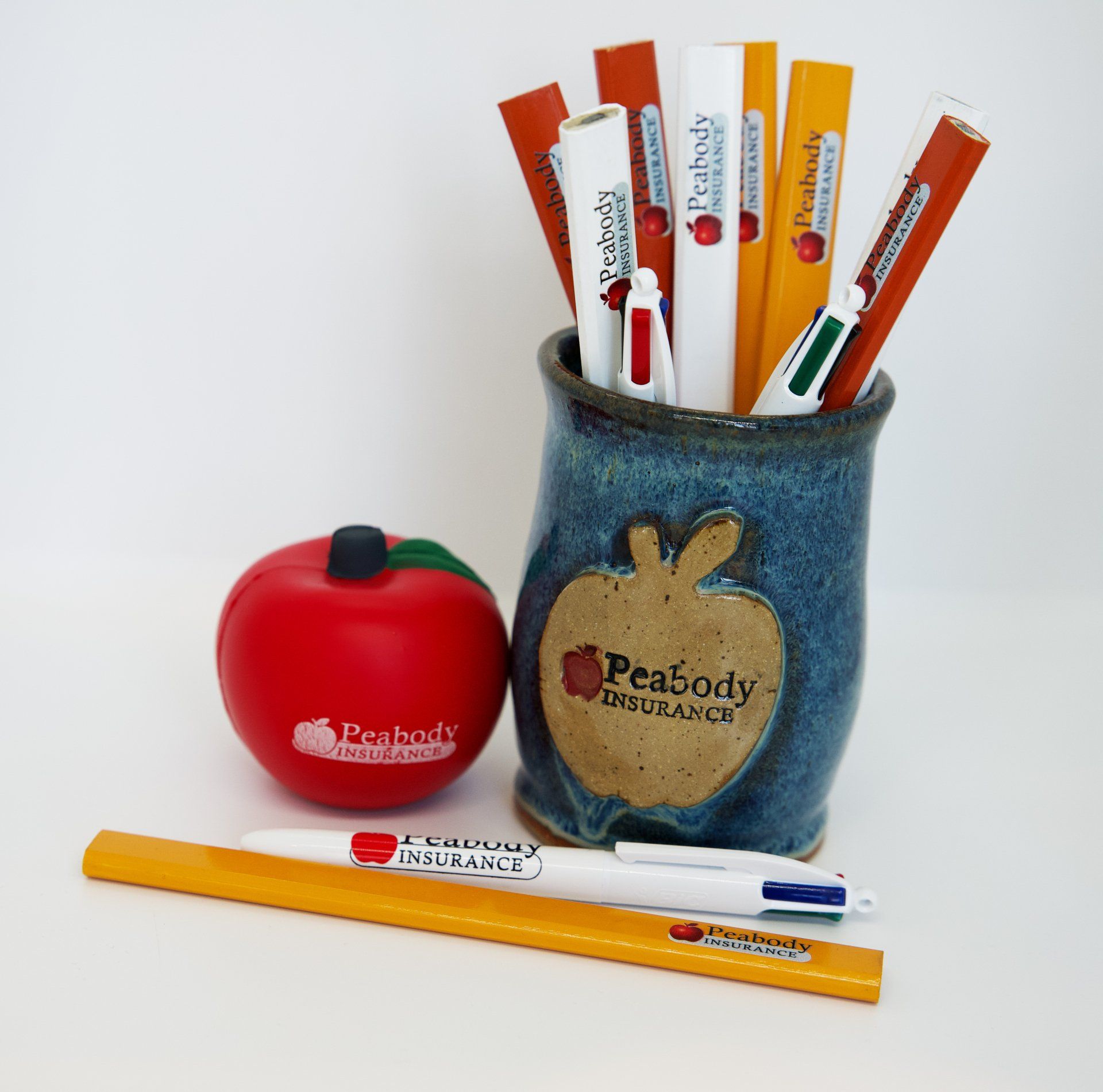 A pen holder that says peabody insurance on it