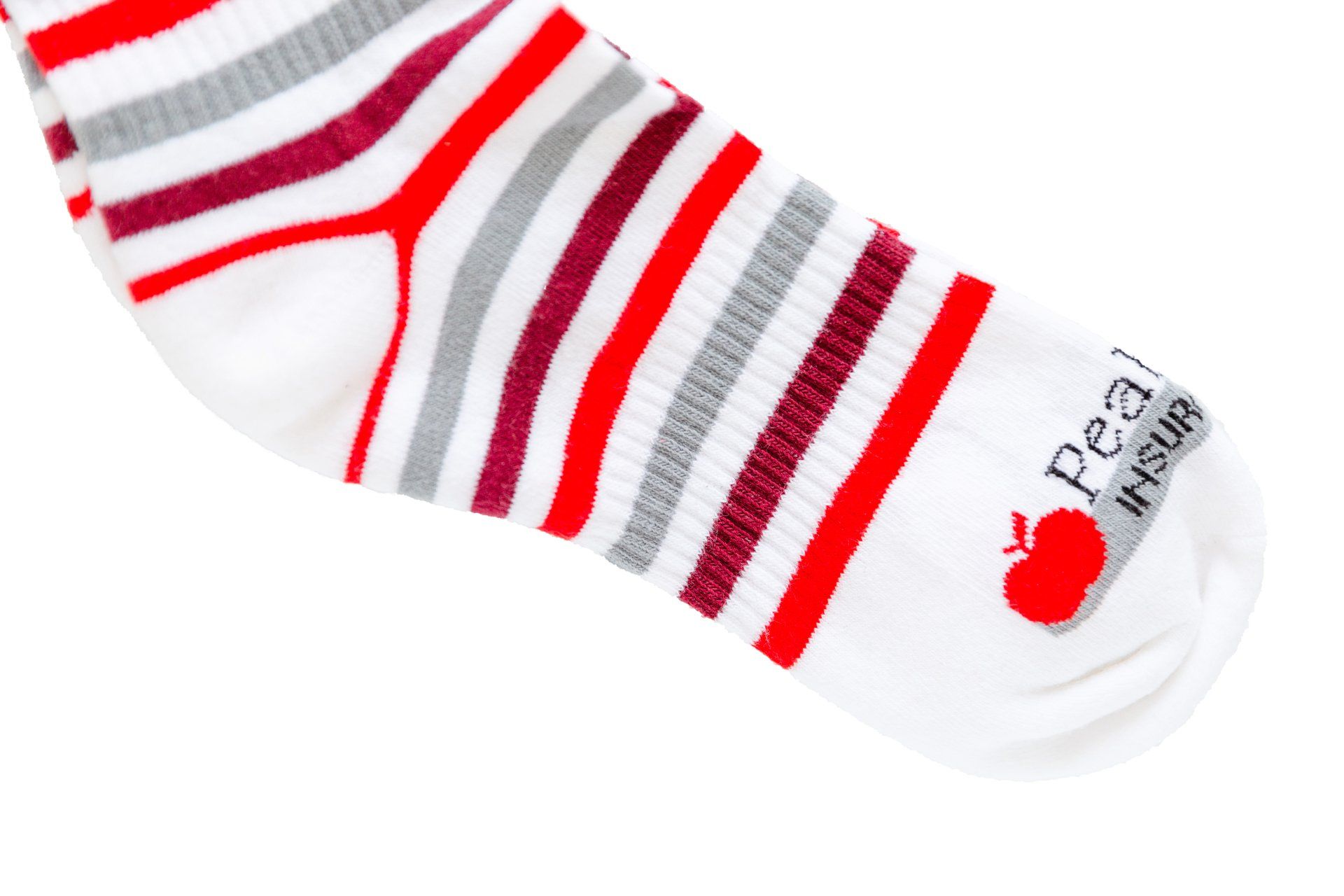 A pair of red and white striped socks that say peel it out