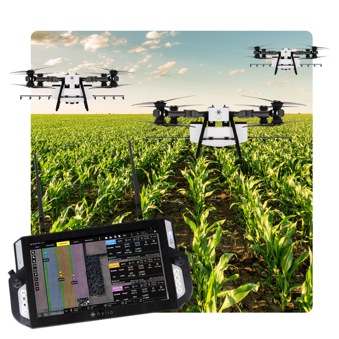 Three Hylio Atlas Drones spraying Crop