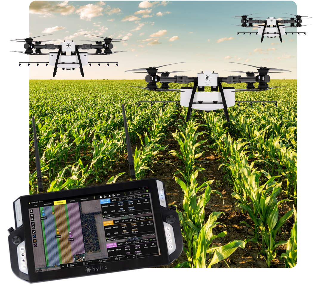 Three Hylio Atlas Drones Spraying Crop