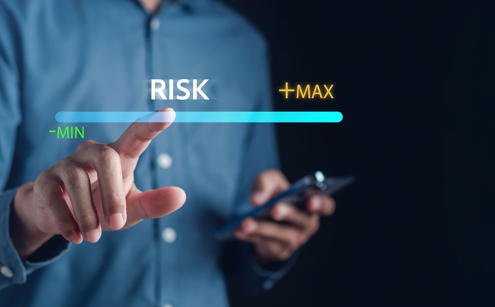 Man using smartphone while adjusting a virtual risk level bar during security assessments.
