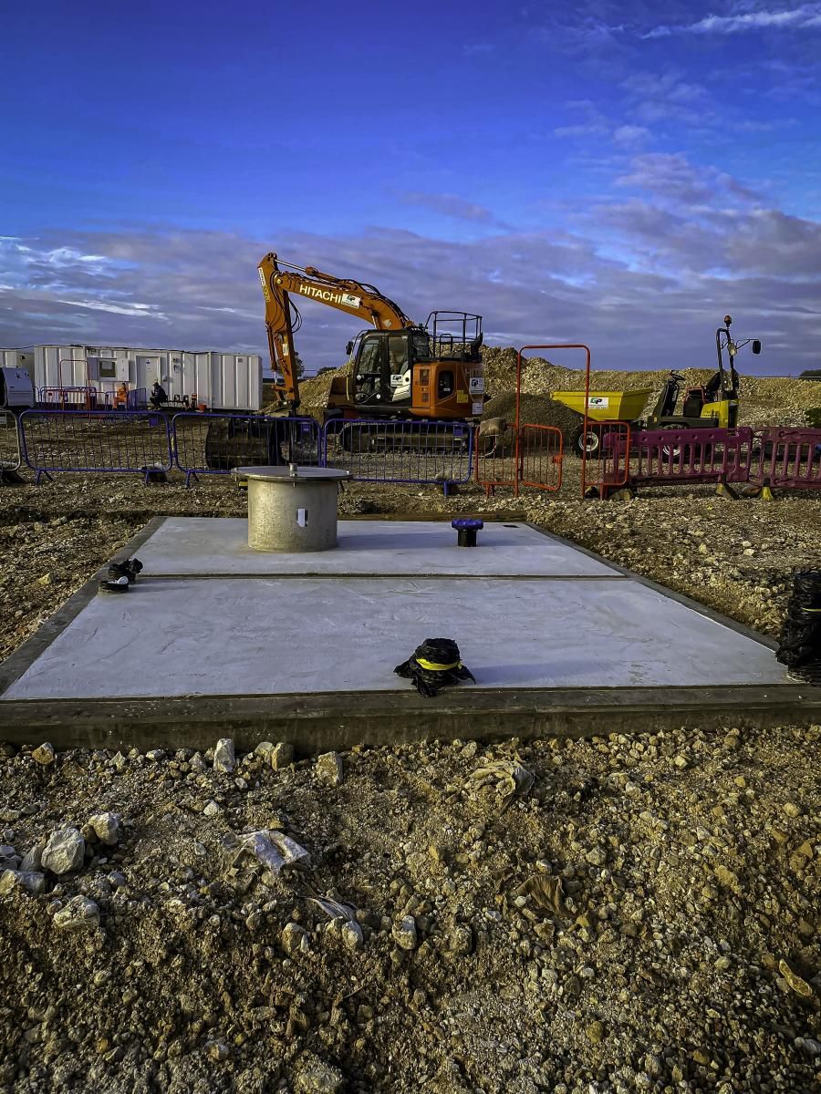 Construction site against a cloudy blue sky.
