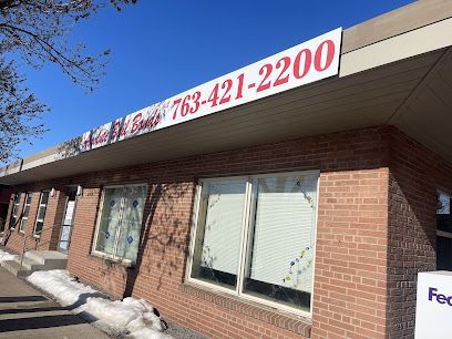 Building with a red brick facade, a sign that reads