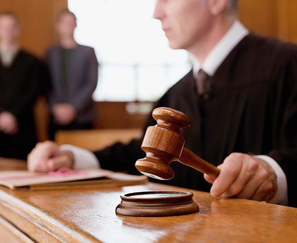 Judge Holding Gavel — St. Minneapolis, MN — Absolute Bail Bonds Judge Holding Gavel — St. Minneapolis, MN — Absolute Bail Bonds