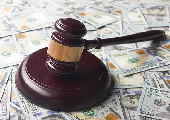 Gavel On Top Of Money — St. Minneapolis, MN — Absolute Bail Bonds