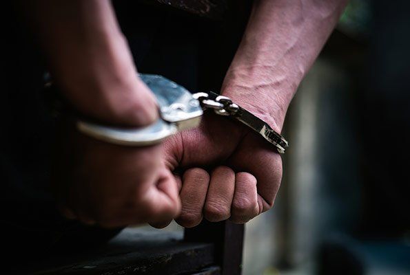 Man With Veiny Hands In A Handcuff — St. Minneapolis, MN — Absolute Bail Bonds Man With Veiny Hands In A Handcuff — St. Minneapolis, MN — Absolute Bail Bonds