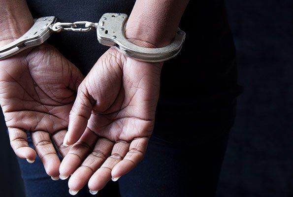 Woman In Handcuffs — St. Minneapolis, MN — Absolute Bail Bonds Woman In Handcuffs — St. Minneapolis, MN — Absolute Bail Bonds
