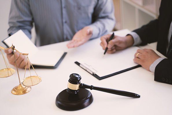 Bail Bond Agents Signing Forms — St. Minneapolis, MN — Absolute Bail Bonds Bail Bond Agents Signing Forms — St. Minneapolis, MN — Absolute Bail Bonds