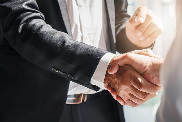 Shaking Hands With Bail Bond Agent— St. Minneapolis, MN — Absolute Bail Bonds