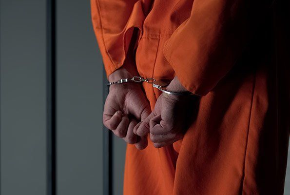 Man On Orange Uniform — St. Minneapolis, MN — Absolute Bail Bonds Man On Orange Uniform — St. Minneapolis, MN — Absolute Bail Bonds
