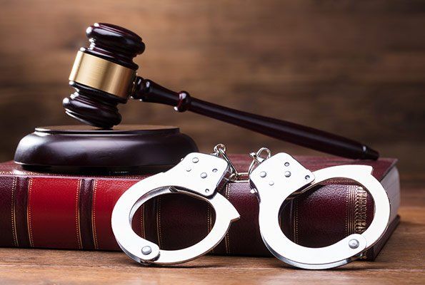 Handcuffs & Gavel On Top Of A Book — St. Minneapolis, MN — Absolute Bail Bonds