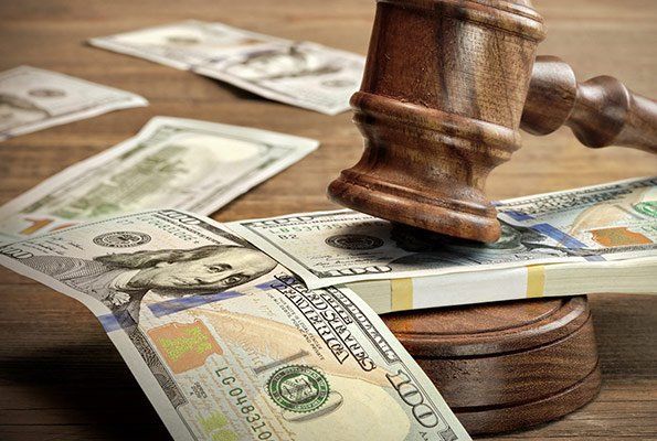 Cash Scattered With Gavel — St. Minneapolis, MN — Absolute Bail Bonds Cash Scattered With Gavel — St. Minneapolis, MN — Absolute Bail Bonds