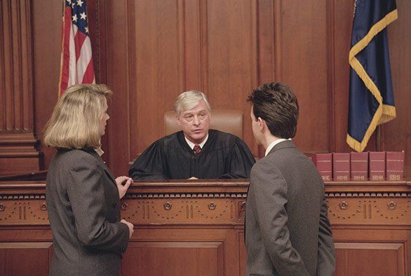 Bail Bond Agents Talking To A Judge — St. Minneapolis, MN — Absolute Bail Bonds