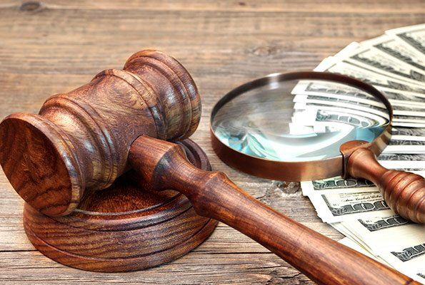 Gavel, Cash & Magnifying Glass — St. Minneapolis, MN — Absolute Bail Bonds