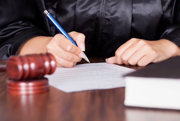 Judge Signing Papers — St. Minneapolis, MN — Absolute Bail Bonds Judge Signing Papers — St. Minneapolis, MN — Absolute Bail Bonds