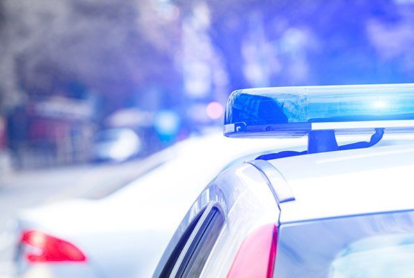 Top Of Police Car — St. Minneapolis, MN — Absolute Bail Bonds