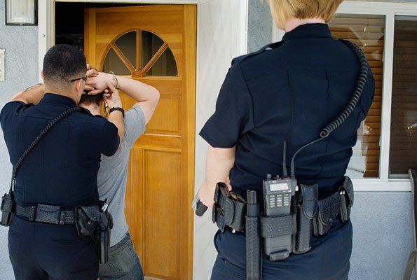 Man Arrested Infront Of House — St. Minneapolis, MN — Absolute Bail Bonds Man Arrested Infront Of House — St. Minneapolis, MN — Absolute Bail Bonds