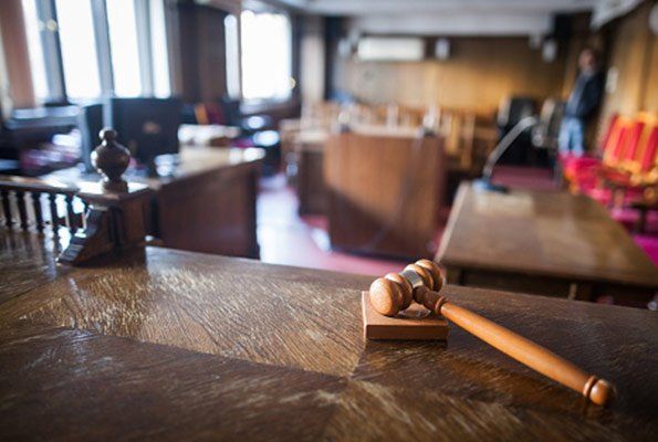Gavel Inside An Empty Courtroom — St. Minneapolis, MN — Absolute Bail Bonds Gavel Inside An Empty Courtroom — St. Minneapolis, MN — Absolute Bail Bonds