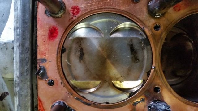 A close up of a piston in a car engine