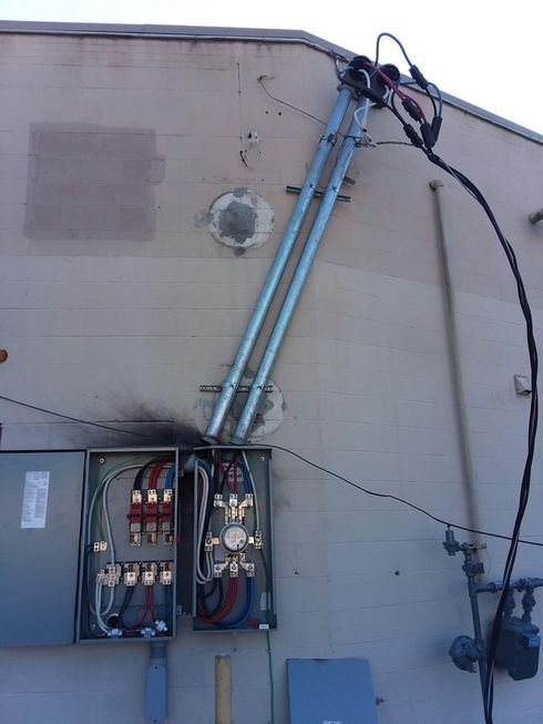 A damaged electrical outlet has the word on it