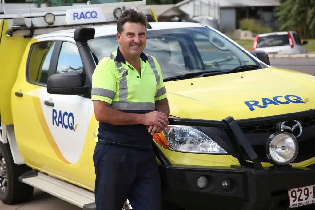 A Man Is Standing In Front Of A Racq Truck — Cam Duffy Autos In Ravenshoe, QLD