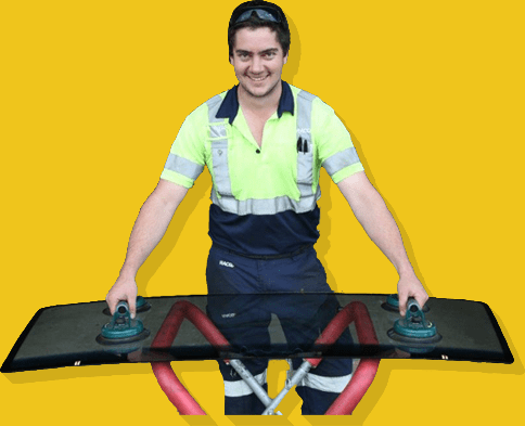 A Man In A Yellow Shirt Is Holding A Piece Of Glass — Cam Duffy Autos In Atherton, QLD