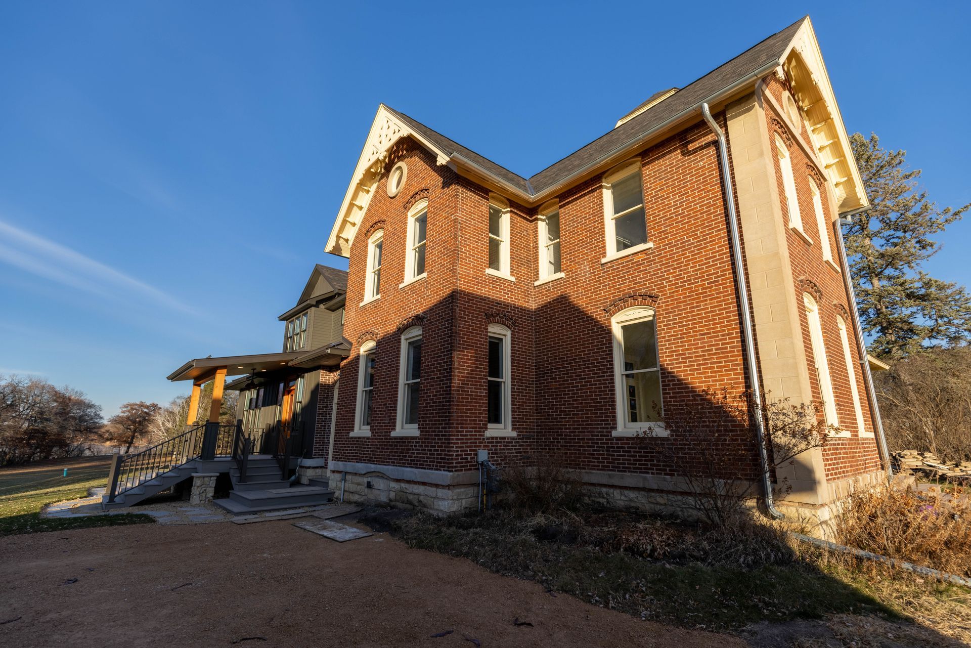 A large brick building with a blue sky in the background