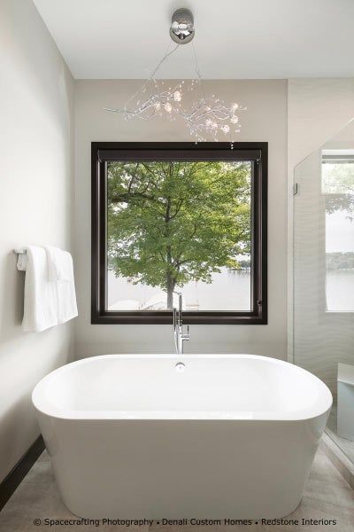a bathroom with a brand new window installed by Sunglass Replacement Windows & Doors