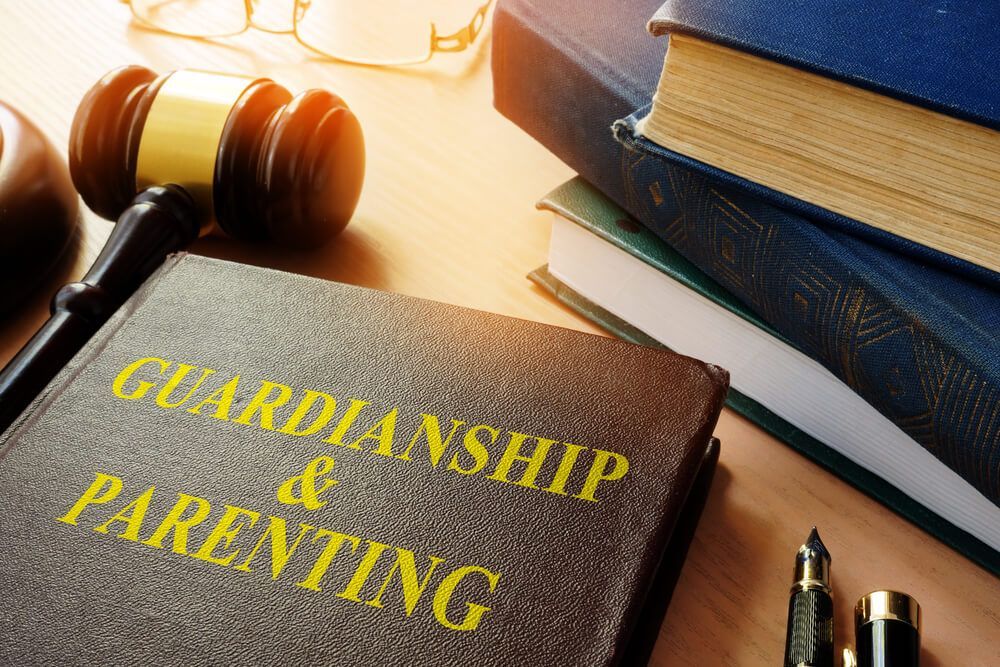Guardianship and Parenting Book Beside a Gavel — Mediation in Wagga Wagga