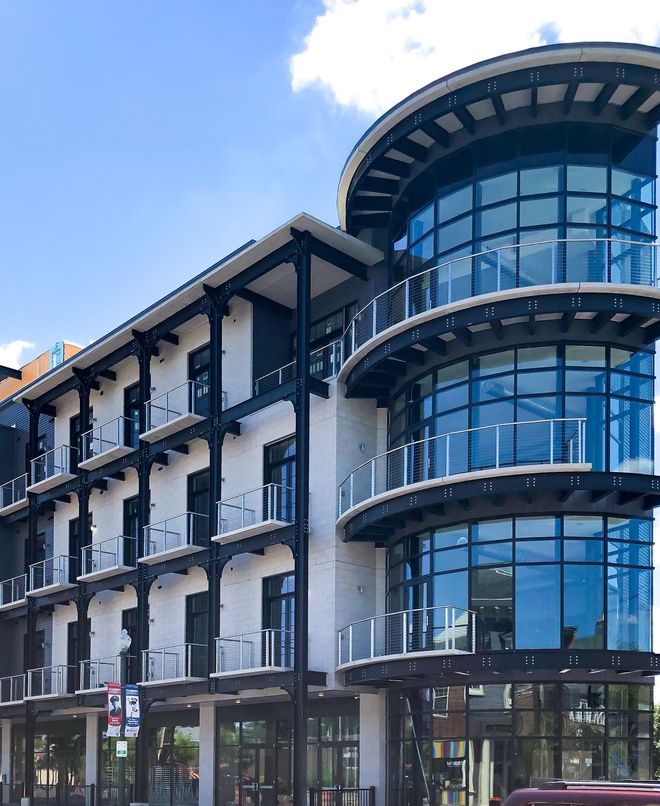 A large building with a lot of windows and balconies