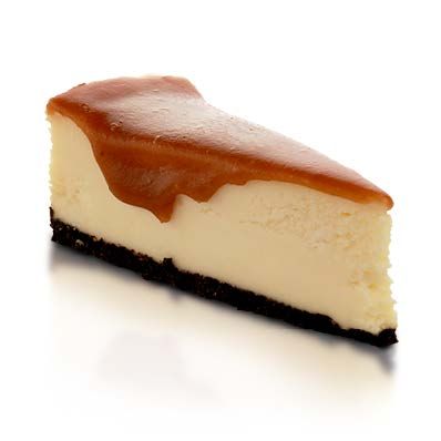A slice of cheesecake with caramel sauce on top