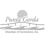 Logo for Punta Gorda Chamber of Commerce: bridge over water, sun, sailboat, and text.