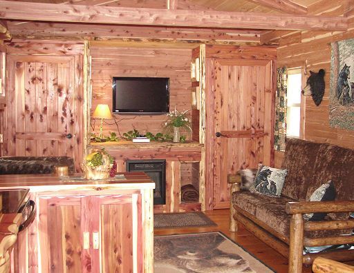 A living room with a couch and a flat screen tv